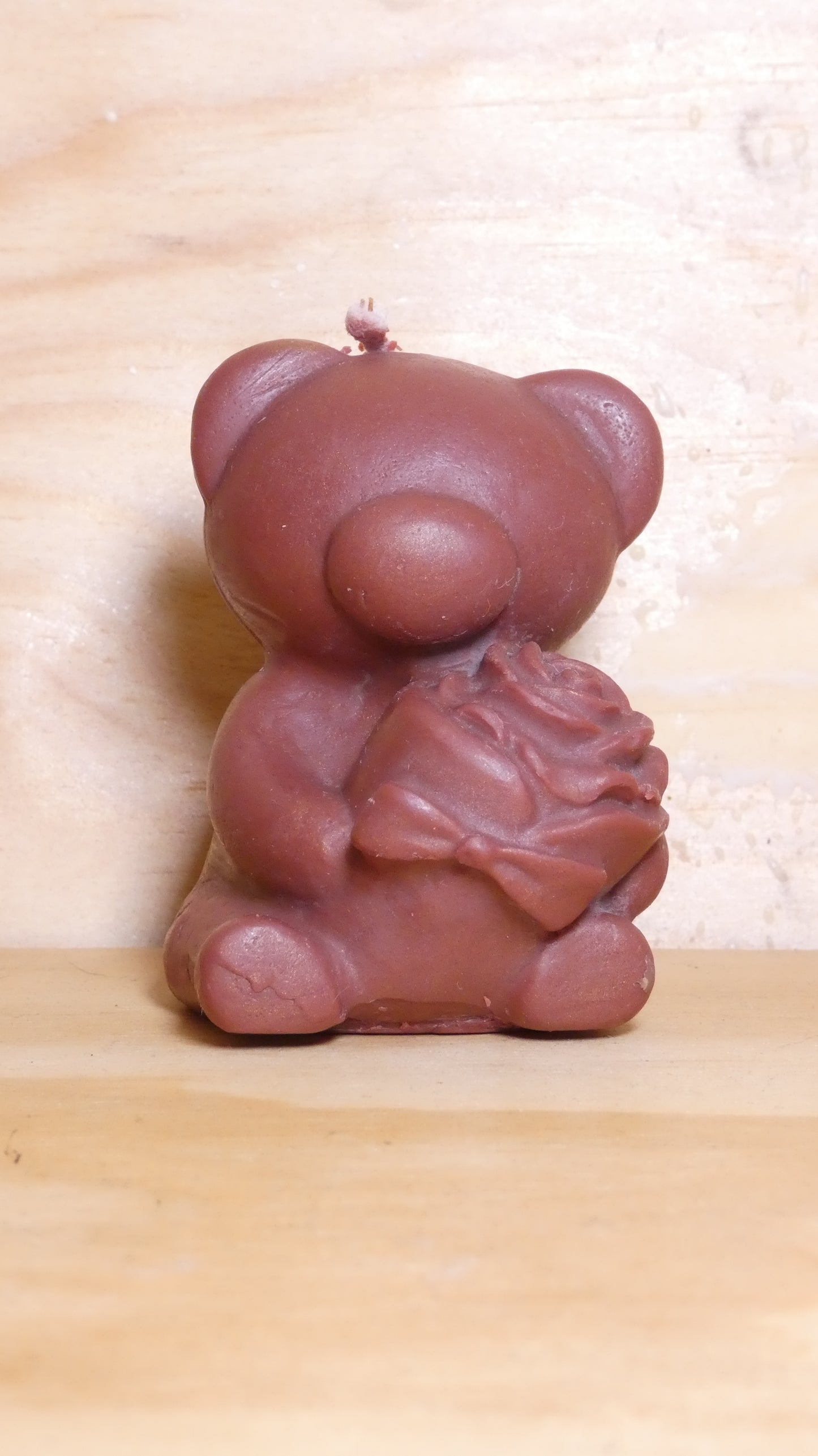 Espelma os amb rosa marró