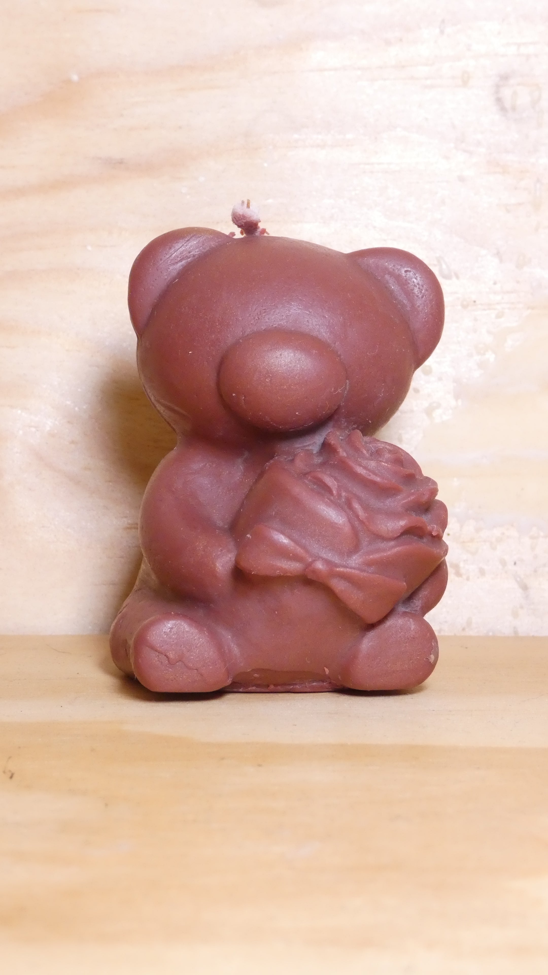 Espelma os amb rosa marró