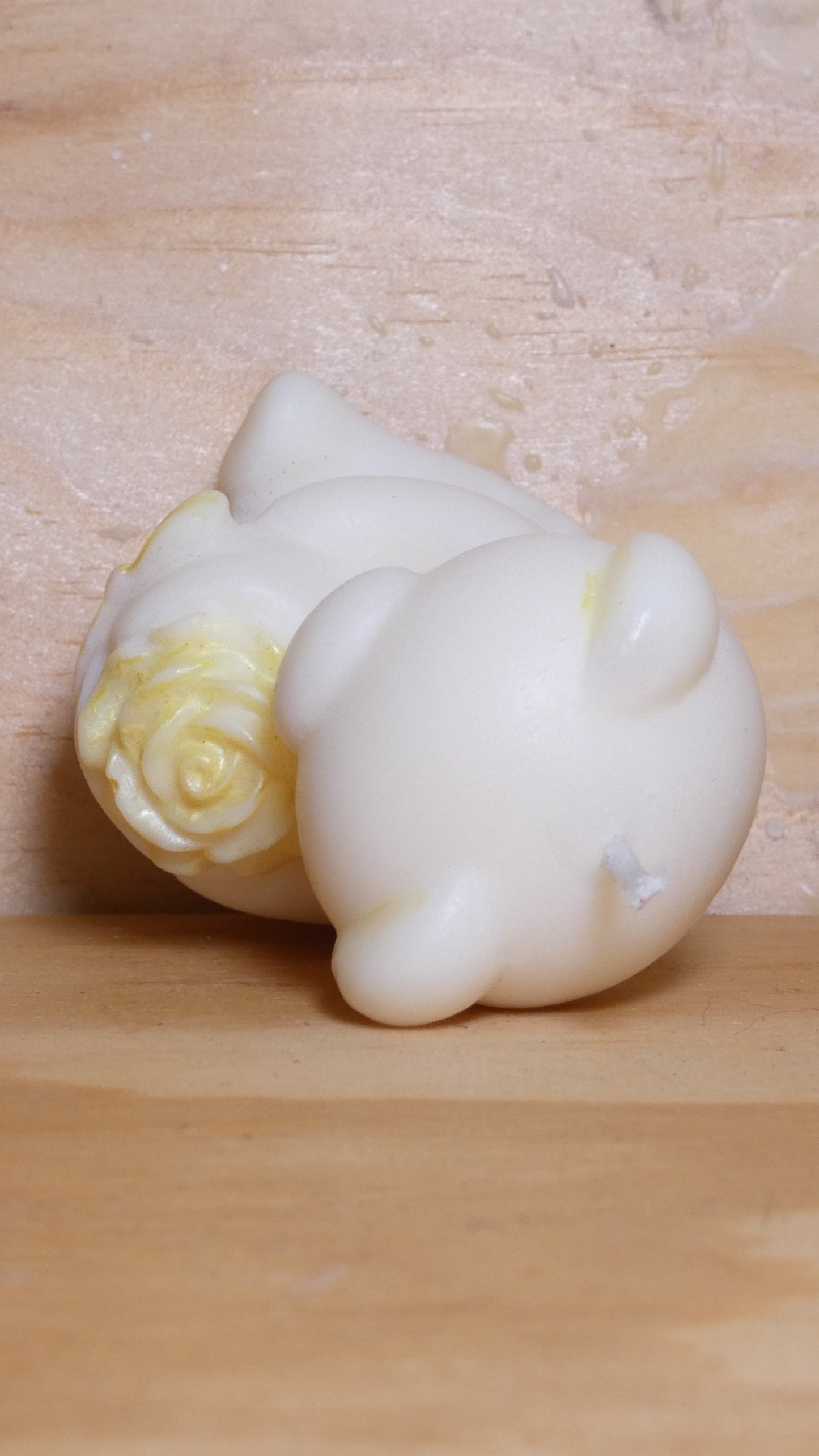 Espelma os amb rosa blanc