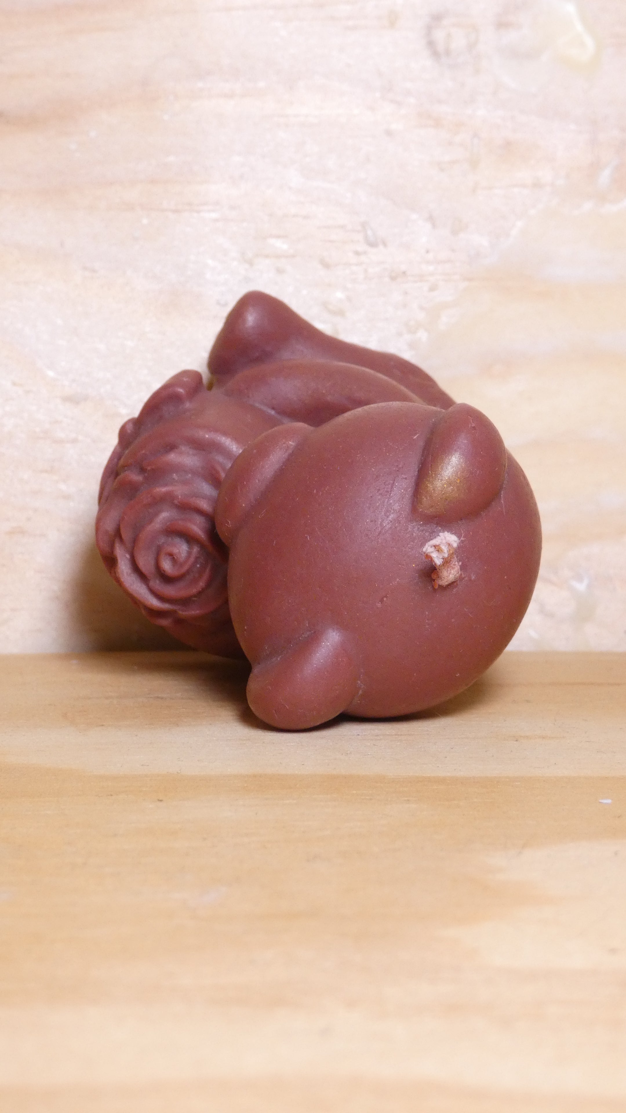 Espelma os amb rosa marró